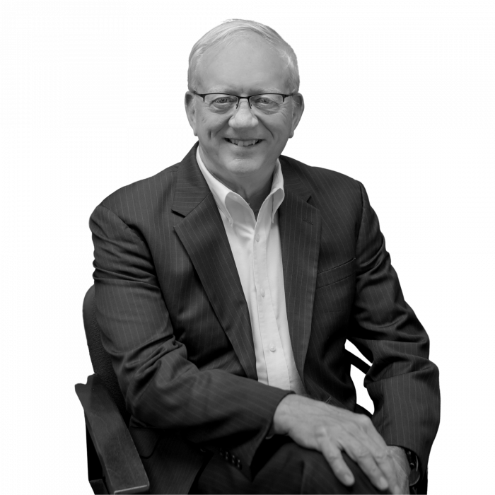 Mixon sitting in chair suit jacket bw trans Mixon sitting in chair suit jacket bw trans